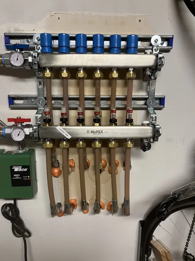 Plumber performing Water Heater Repair at a residential property in St. Martin